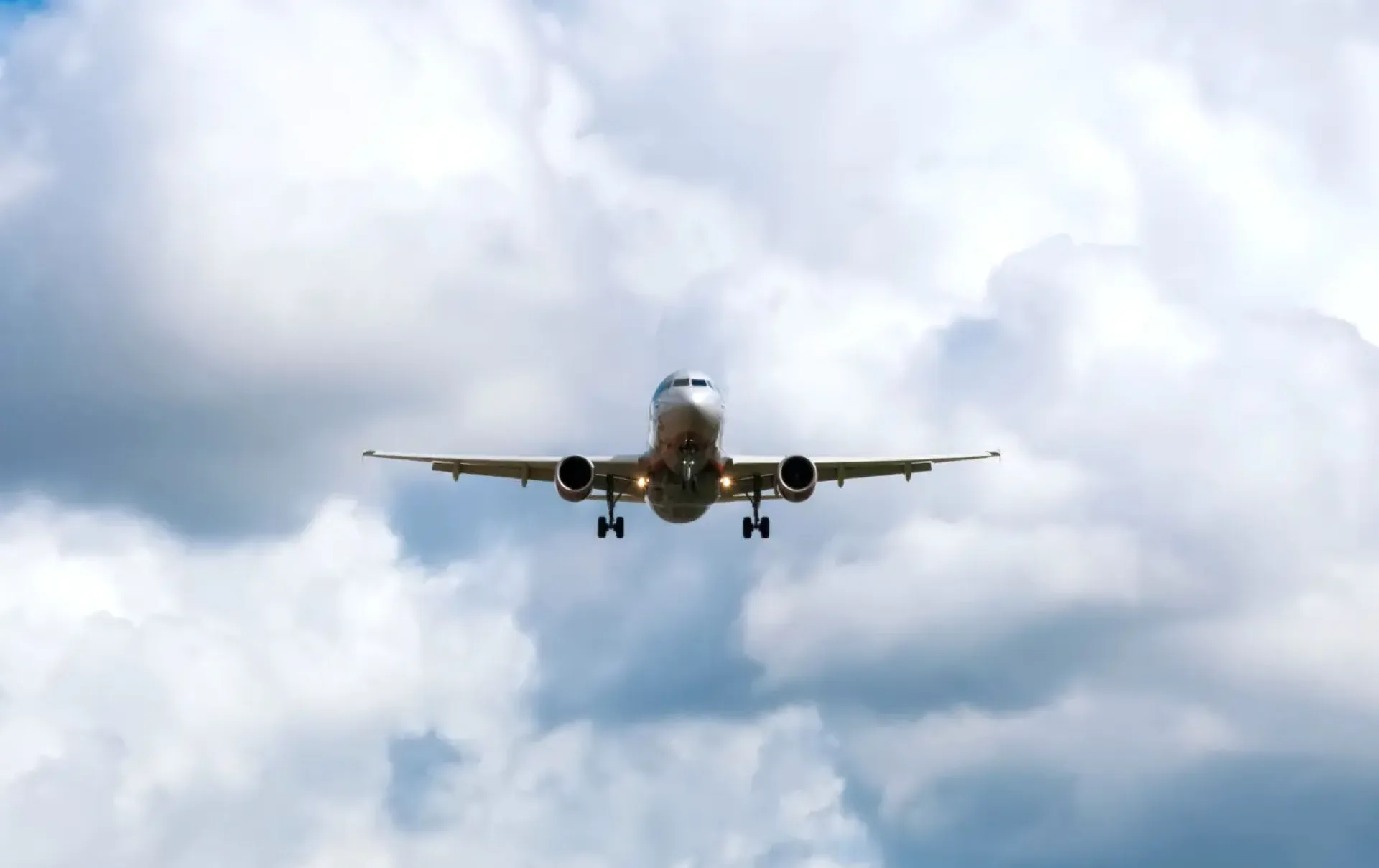 plane landing with headlights on